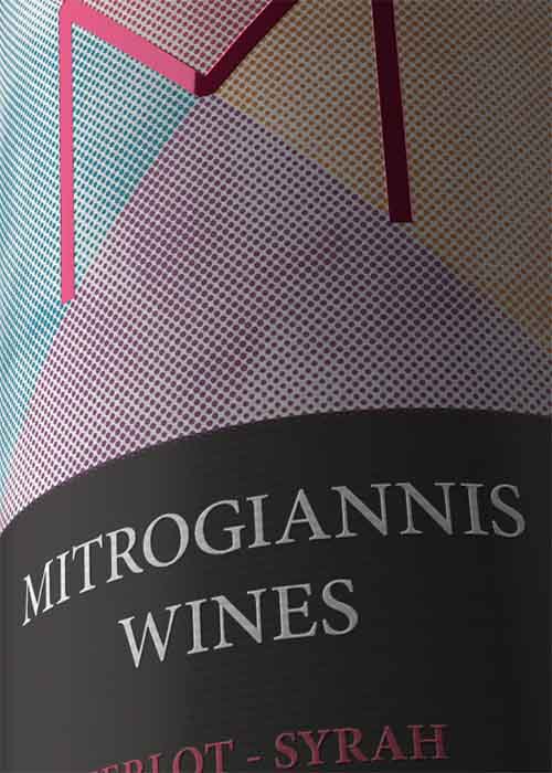 Detail view of custom adhesive label for red wine with distinctive visual identity and brand elements. NO IDEA. Branding Graphic Design Agency.