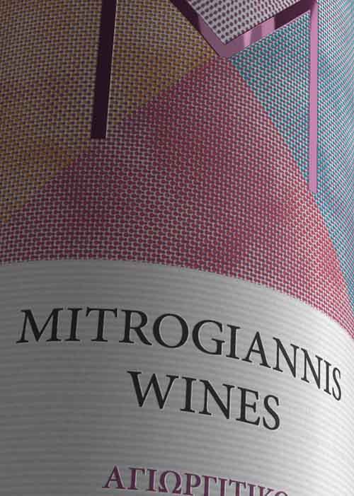 Detail of rosé wine sticker label highlighting the warm color palette and artisanal design elements. NO IDEA. Branding Graphic Design Agency.