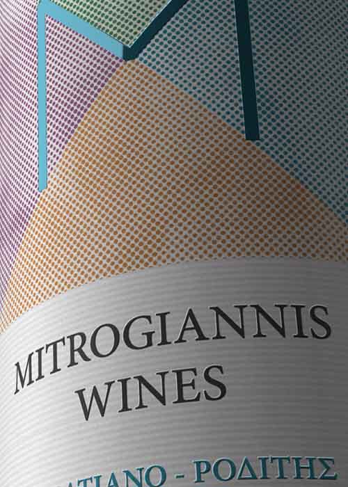 Close-up view of premium white wine adhesive label showing intricate printing techniques and branding. NO IDEA. Branding Graphic Design Agency.