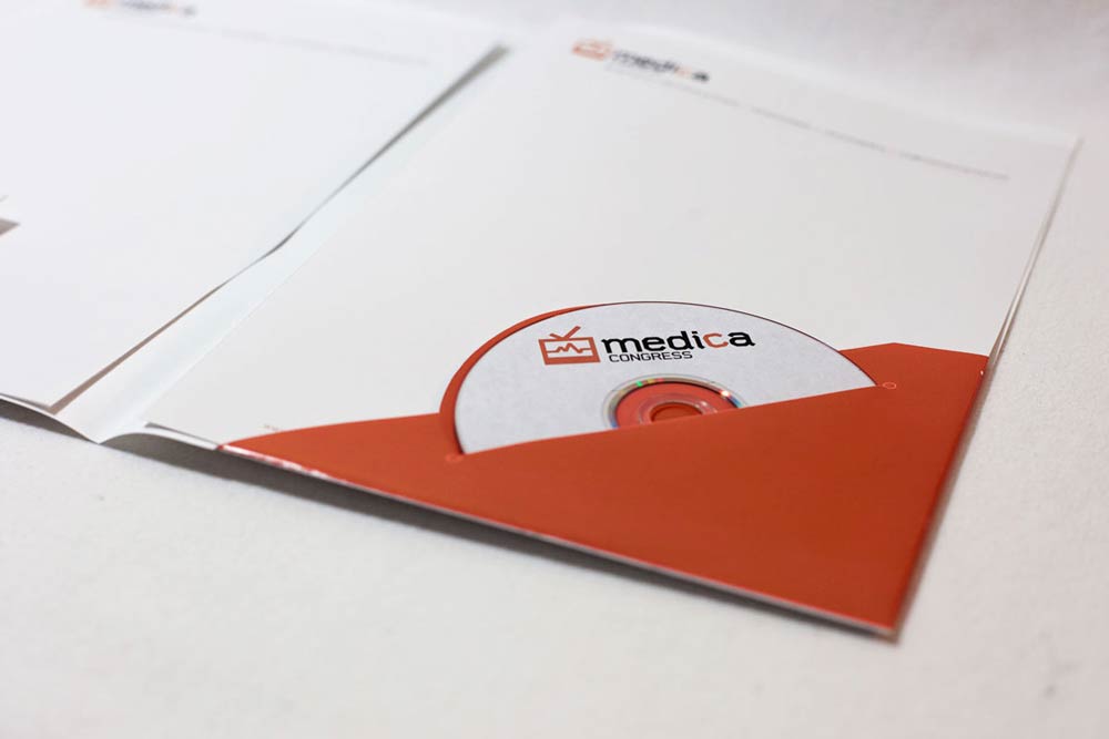 Congress materials and event collateral for medical professionals featuring elegant typography and layout. NO IDEA. Branding Graphic Design Agency.