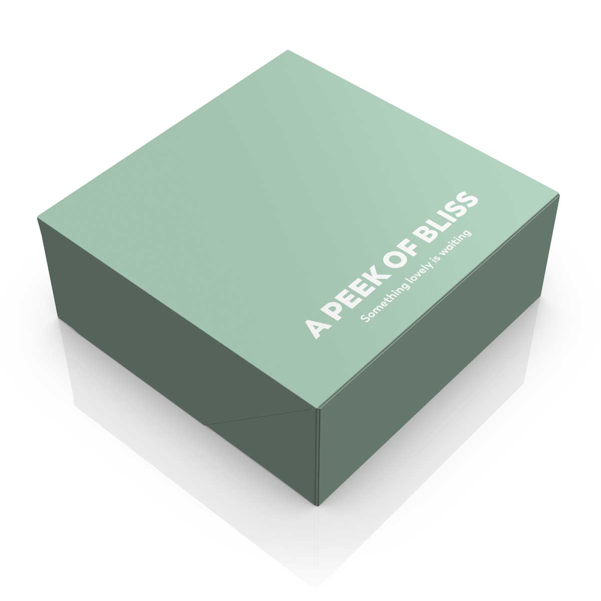 Green pastry box design with die cut, typographic message and soft pastel colors. NO IDEA Branding Graphic Design Agency