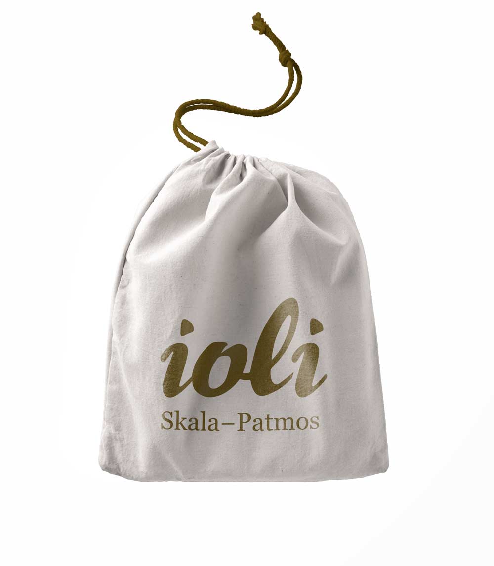 Drawstring pouch packaging design for IOLI tourist gift shop with island-inspired visual identity. NO IDEA. Branding Graphic Design Agency.