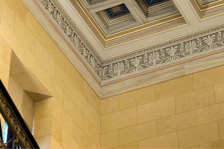 Interior details of historic building with classical architectural elements and decoration. NO IDEA. Branding Graphic Design Agency.