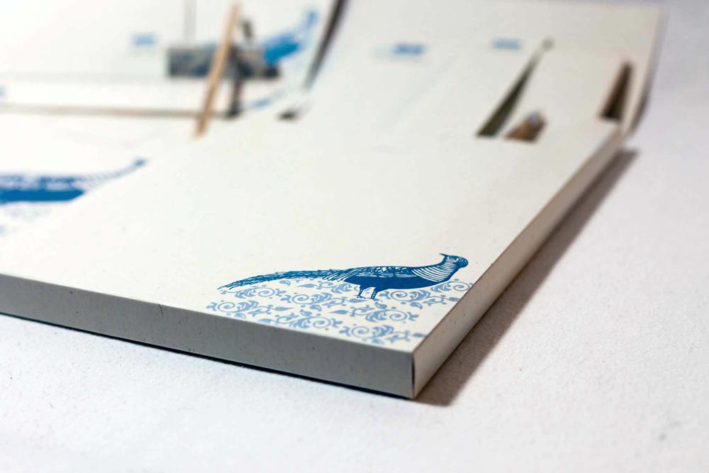 Professional presentation folder design featuring illustrated architectural elements and motifs. NO IDEA. Branding Graphic Design Agency.